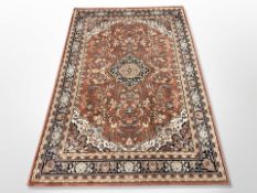 A machine-made rug of Persian design,