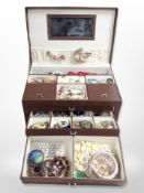 A contemporary jewellery casket containing assorted bead necklaces, stainless steel wristwatch,
