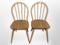 A pair of Ercol elm and beech spindle back dining chairs