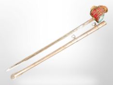 A reproduction Scottish basket-hilted broadsword in scabbard.