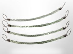 A set of four glass twist-stem napkin holders with silver-plated mounts, each 23cm long.