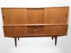 A Danish teak sliding door sideboard,