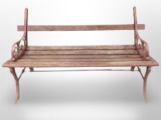 A cast iron framed painted garden bench,