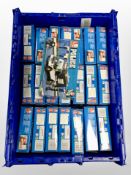 A box of Sluban Police model sets.
