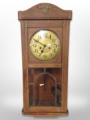 A Continental oak eight day wall clock,