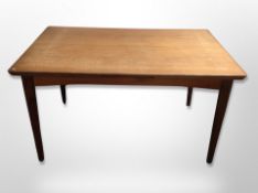 A 20th century Danish teak pull out extending dining table,