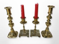 Two pairs of brass candlesticks,