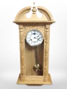 A continental blond oak eight day wall clock with moonphase dial,