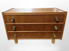 A Danish teak miniature three drawer chest,