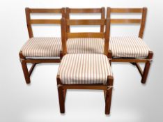 A set of four pine dining chairs