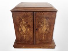A walnut and satinwood inlaid table top cabinet fitted with drawers,