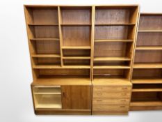 A 20th century Danish teak and plywood sliding door bookcase,
