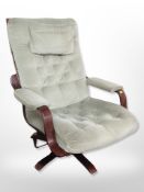 A bent laminated beech framed swivel armchair