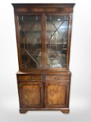 A reproduction mahogany bookcase,