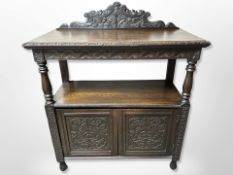 A Victorian carved oak dumb waiter,