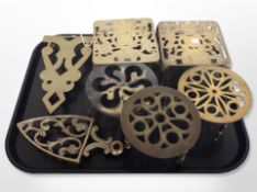 A group of brass trivets