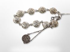 A silver rose link bracelet and a further bracelet with pierced silver disc
