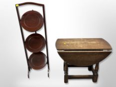 A mahogany three-tier cake stand and small drop leaf table