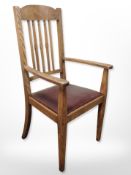 An Edwardian oak armchair
