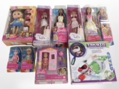A box of Mattel Barbie dolls and a Teksta Micro Pets figure,