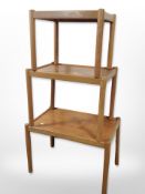 A three graduated teak tables,