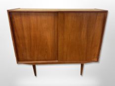A Danish teak sliding door sideboard,