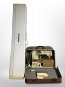 A Bernina electric sewing machine in case together with a knitting machine