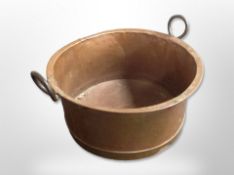 A large 19th century copper log bin with cast iron handles,