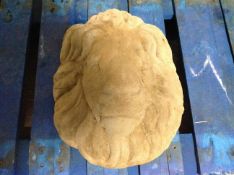 A concrete garden lion mask, length 38cm.