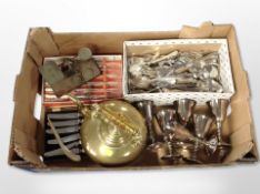 A box of brass kettle, assorted plated cutlery, set of six goblets,