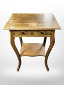 An oak two drawer occasional table,