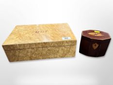 A George III octagonal mahogany and satinwood inlaid tea caddy with foil lining together with a