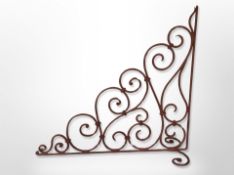 A painted wrought metal bracket,