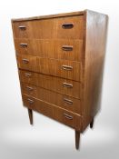 A 20th century Danish teak and pine six drawer chest on tapered legs,