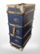 A vintage canvas and wooden bound trunk,