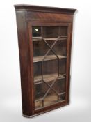 A 19th century mahogany hanging corner cabinet,