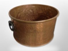 A large 19th century copper log bin with cast iron handles,