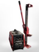 A Clarke Power 700w generator and a hydraulic jack