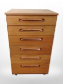 A Schreiber teak six drawer chest,