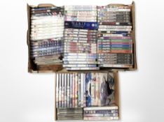 Two boxes of assorted DVD's and CD's