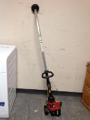 A Homelite petrol strimmer