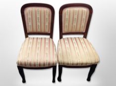 A pair of mahogany dining chairs on paw feet