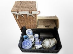 A wicker hamper and magazine rack,