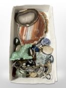 A group of agate geode slices, jade carving of a horse,