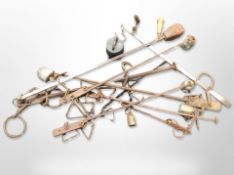 A group of antique metal scales with weights.