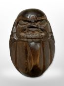 A Japanese folk art Deruma Koreshi doll, signed, height 13cm.