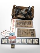 A group of metal candle sconces, contemporary candelabrum, decorative signs, etc.