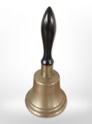 An early 20th-century brass school bell, height 26cm.