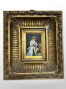 Contemporary school : A girl playing with a kitten, oil on panel, 16cm x 11cm, in ornate gilt frame.