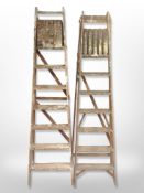 Two vintage wooden step ladders.